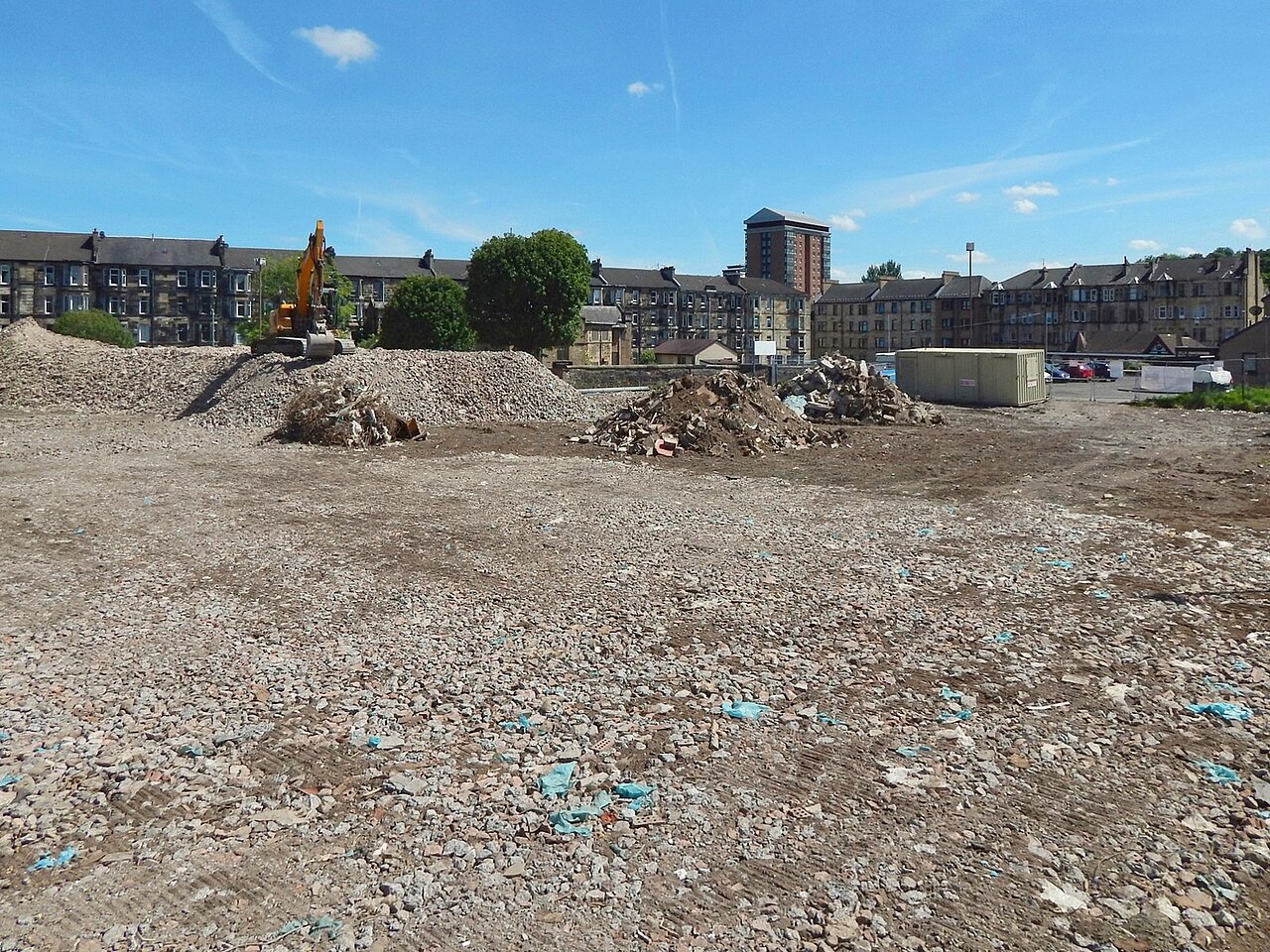 Cleared, leveled lot after demolition and haul-off